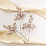 Zestaw wsuwek ślubnych z kwiatami i listkami rose gold